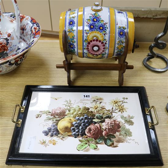 A Continental tinglaze pottery spirit barrel and a pottery tile tray